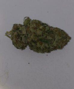 Close-up of premium Bubba Kush AAA cannabis flower. High-quality cannabis bud showcasing its dense structure and trichome coverage. Superior quality Bubba Kush AAA product.