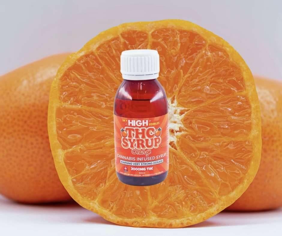 Bottle of Sky High Edibles THC syrup, Orange flavour, 3000mg THC