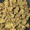 Close-up image of White Widow cannabis flower, a AA hybrid with frosty resin-coated buds and a THC range of 16%-19%.